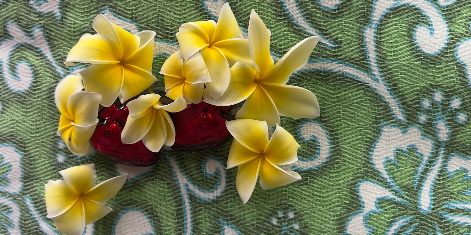 Yellow flowers on a green patterned fabric background